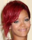 Rihanna with short red hair in an asymmetrical cut