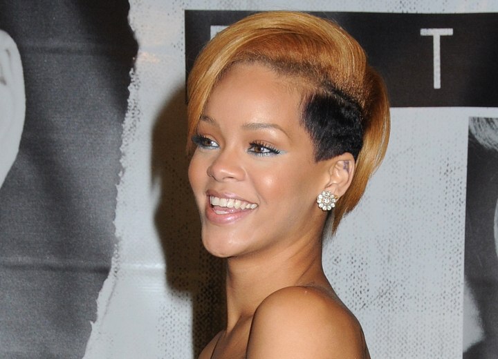 Rihanna with her hair clipped around the ears