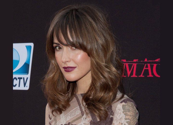 Rose Byrne with her hair styled into a zigzag wave