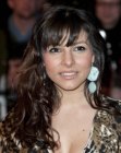 Roxanne Pallett's long layered hairstyle with textured ends and waves
