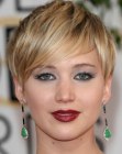 Jennifer Lawrence wearing her hair in a pixie with a long sideswept fringe