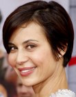 Catherine Bell's with her hair cut short and styled smooth