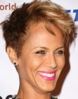 Nicole Ari Parker sporting a very short clipper cut pixie hairstyle