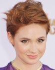Karen Gillan with her red hair cut in a pixie with height