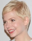 Michelle Williams with her blonde hair cut in a pixie