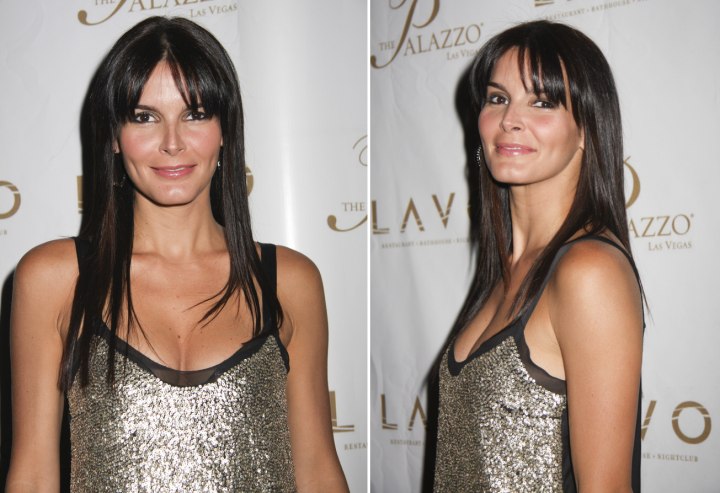 Angie Harmon wearing her hair long with heavy bangs