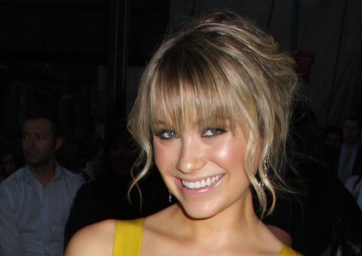Katrina Bowden wearing her shag cut hair up with a loose knot