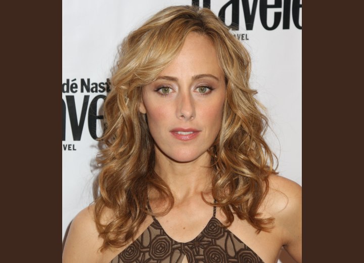 Kim Raver's long layered hair with tousled curls