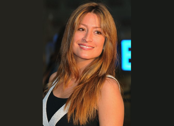 Rebecca Loos wearing her hair in a simple long and layered style