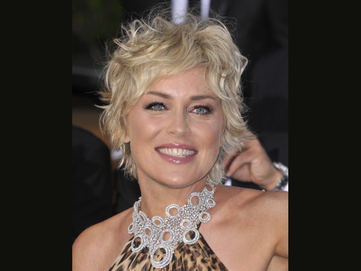 Sharon Stone wears a ruffled shag haircut with straight sections, loops, 