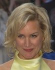 Alice Evans sporting a neck length shag with curls