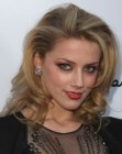 Amber Heard's shoulder length layered hair styled for a romantic appeal