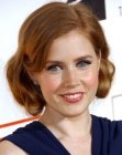 Amy Adams with her hair up and tucked behind her ears