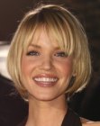 Ashley Scott with bouncing short hair that just covers the ears