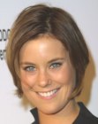Ashley Williams wearing her hair in a short hairstyle with tapering