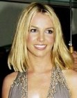 Britney Spears with shoulder length hair and a middle part
