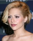 Brittany Murphy sporting curled short hair with a smoothed side