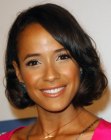 Dania Ramirez wearing her hair in a bob with the bangs styled to one side