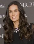 Demi Moore wearing her hair very long and curled