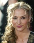 Drea DeMatteo sporting a long center parted hairstyle with curls