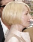 Ellen Barkin wearing het blonde hair in a short bob with long bangs