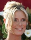 Heidi Klum with her hair styled up in a French twist