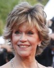 Jane Fonda sporting a short shag hairstyle with ends that flip up