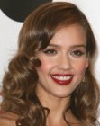 Jessica Alba's long hairstyle with curls and waves that begin at eye level