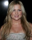 Jessica Capshaw wearing her hair long and with a sixties or seventies appeal