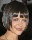 Katie Holmes wearing her hair in a short bob with sleek styling