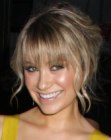 Katrina Bowden's shag hair styled up in a loose knot