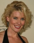 McKenzie Westmore wearing her hair in a short style with a lot of bounce