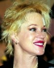 Melanie Griffith wearing her hair short and cut to the middle of her ears