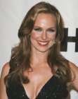 Melora Hardin's long hairstyle with large curls at the ends