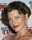 Milla Jovovich sporting a short haircut that exposes her ear lobes