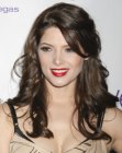 Ashley Greene wearing her brown hair loosely curled