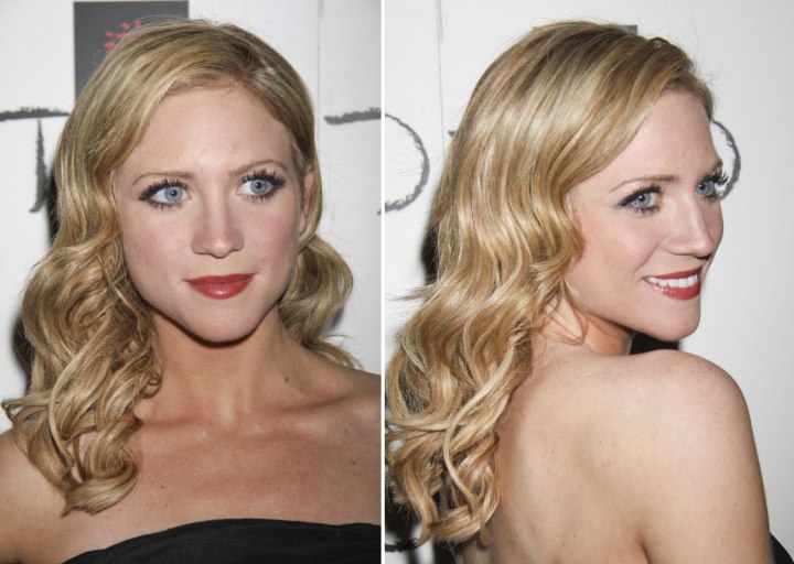 Brittany Snow wearing her long hair styled for a retro look