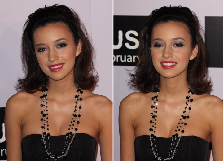 Christian Serratos has luscious deep dark brown hair that is clipped to flip