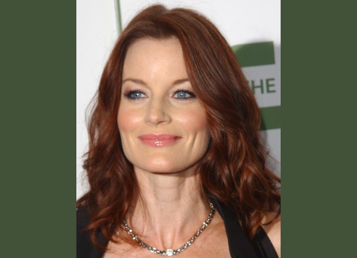 Laura Leighton - Red hair with lazy curls that nestle around the shoulders