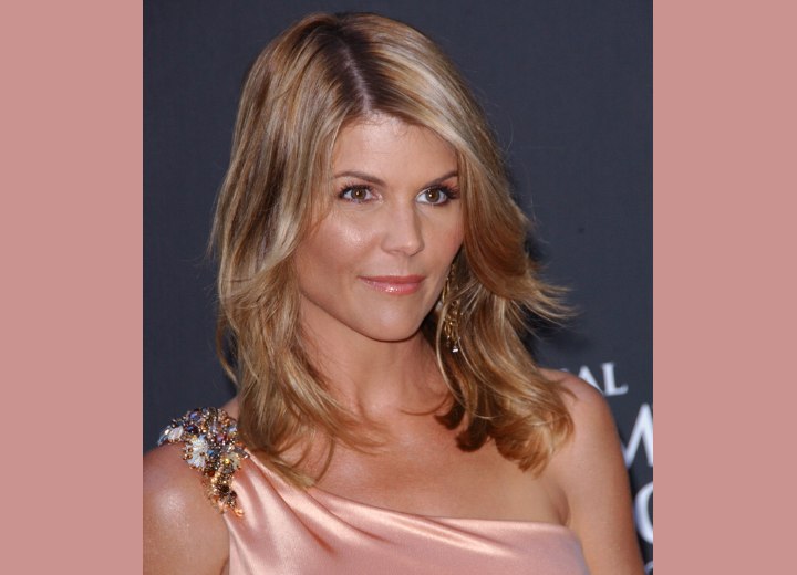 Lori Loughlin with long off center parted hair