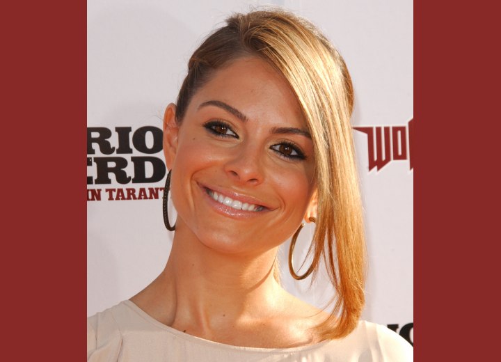 Maria Menounos with her hair styled smoothly back