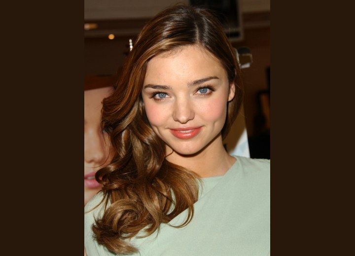 Miranda Kerr with long hair and curls over her shoulders