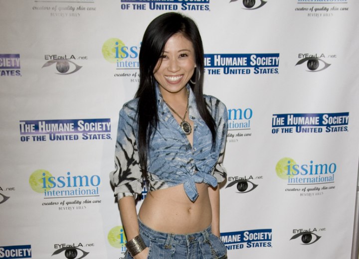 Adrienne Lau wearing low cut jeans and a blouse