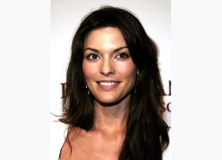 Alana De La Garza with long hair falling below her shoulders