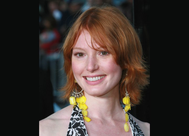 Alicia Witt with her hair cut to mid length in a shag style