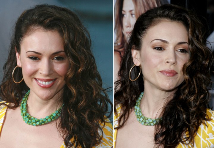 Alyssa Milano wearing her long hair styled on the side