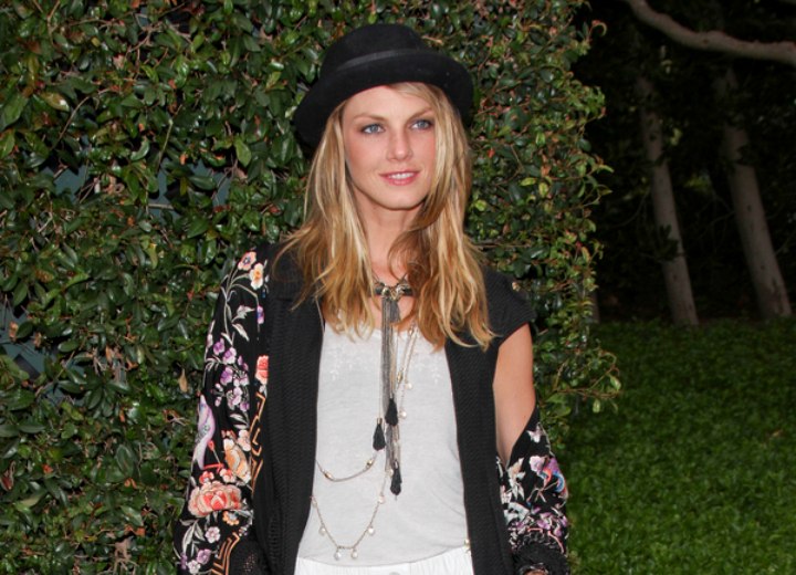Angela Lindvall wearing a short skirt and a large shawl