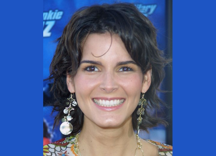 Angie Harmon - Medium hairstyle styled loose and ruffled