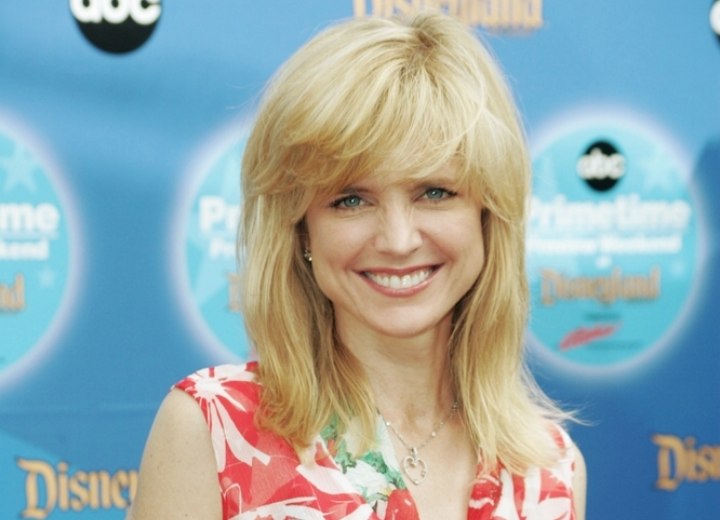 Courtney Thorne-Smith - Long hairstyle with feathered bangs