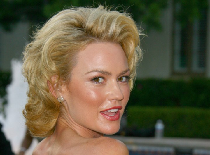 Kelly Carlson sporting a sexy Marylin Monroe style with hair rolled over